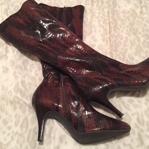 Brown boots with the look of snake skin