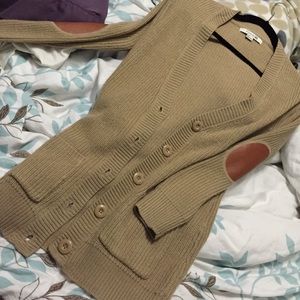 Boyfriend sweater with leather elbow patch.