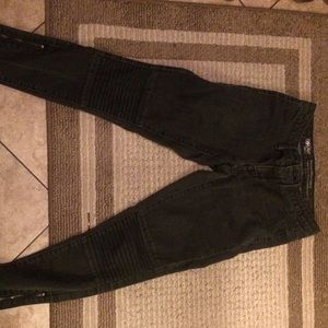 Black jeans with knee detailing and ankle zippers