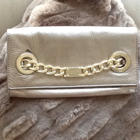 Gold Michael Kors clutch.