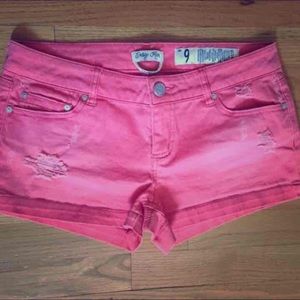 coral pink lightly distressed shorts