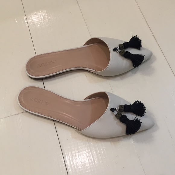 Slip on jcrew shoes with tassels.