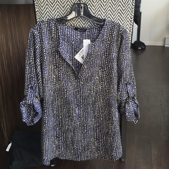 Navy polka-dotted blouse