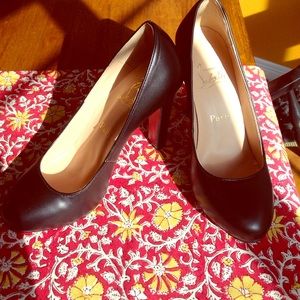 Christian Louboutin black heals.