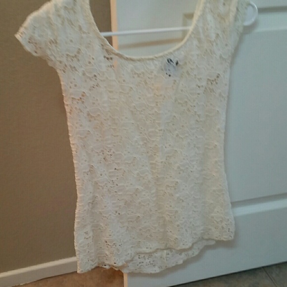 White top with bow on the back