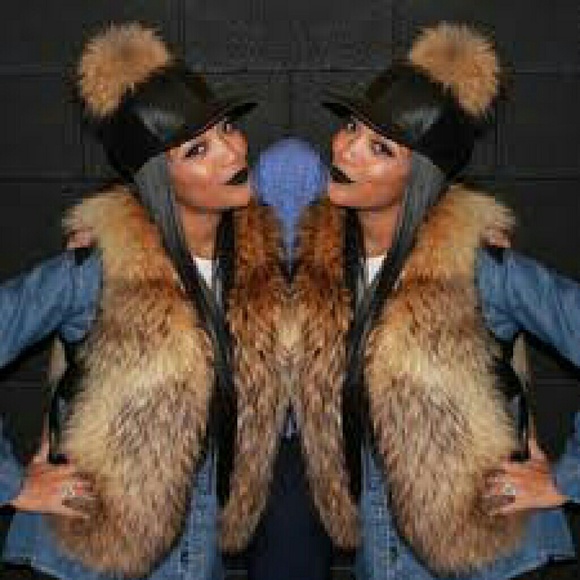 Leather hat with pom pom