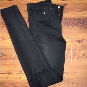 High wasted skinny jeans with rips in each knee!