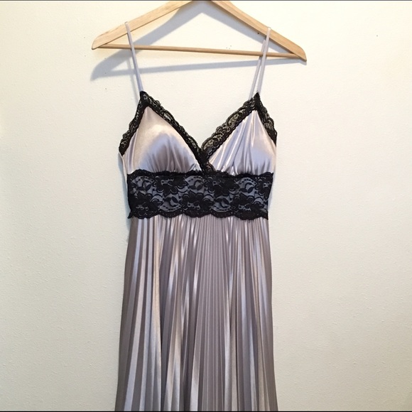 Silver dress. Black lace. Pleated skirt.