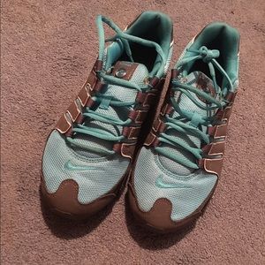 Teal and gray Nike shox.