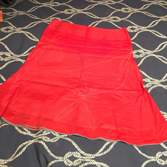 Detailed Pink skirt with blue stitched flowers&hem