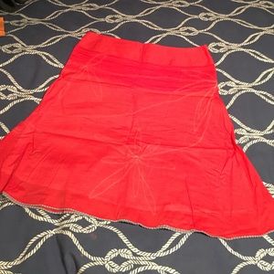Detailed Pink skirt with blue stitched flowers&hem