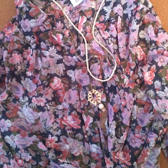 Sheer floral top with rolled sleeves