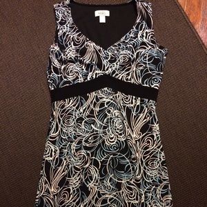 Patterned dress. Flattering cut but modest fit