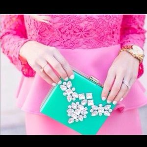 Brand new mint clutch retail for $68.00