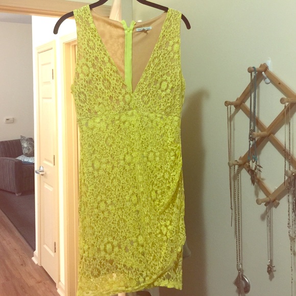 Bright yellow lace dress with nude under slip