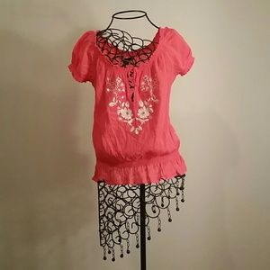 Ruffled neck and bottom, blouse with flower design