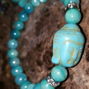 Buddha and blue shell beaded bracelet. Cz spacers