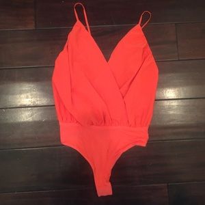 Coral orange criss cross open back bodysuit