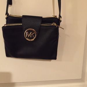 Black cross body Michael Kors purse