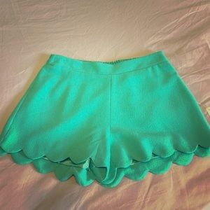 Green scalloped shorts