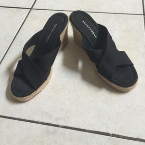 Woven wedge heels with black straps. Worn once.