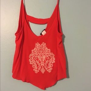 Coral embroidered top.