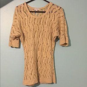 Tan knit sweater.