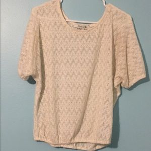 Light tan crochet sweater.