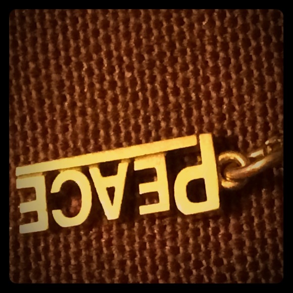 T&Co peace charm 18k