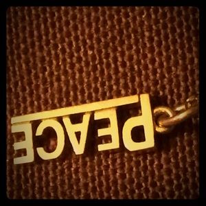 T&Co peace charm 18k