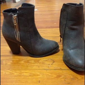 Dark brown booties with gold zipper detailing
