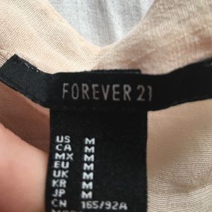 Forever 21 shirt. Longer in back than front.