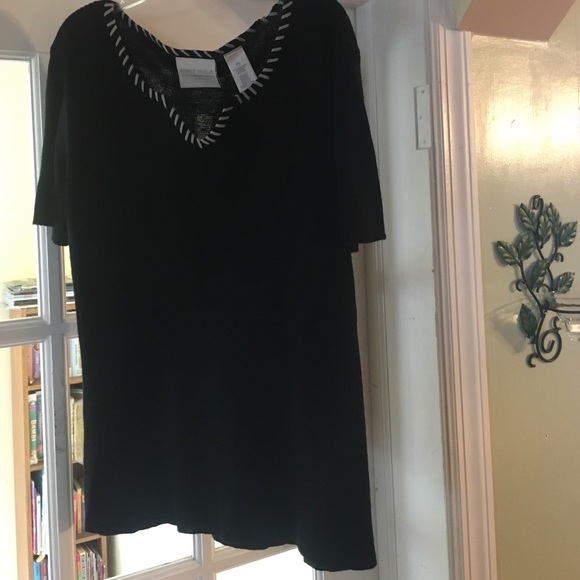 Black blouse with white embroider  collar.