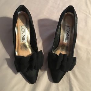 Black satin heels with bow detail