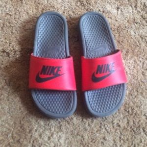 Red and black Nike sandals
