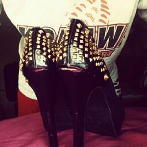 Black studded gold heels