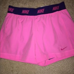 Pink nike running shorts with built in Nike pros