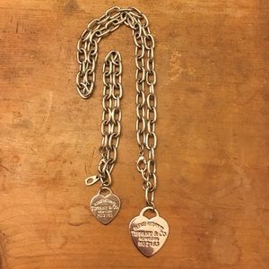 Matching silver tone heart necklace and bracelet.