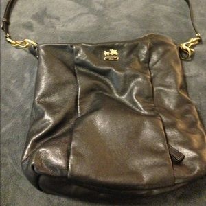SOLD Black coach bag with gold hardware.