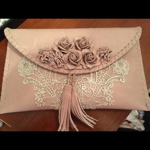 Charming Charlie lace tassle clutch