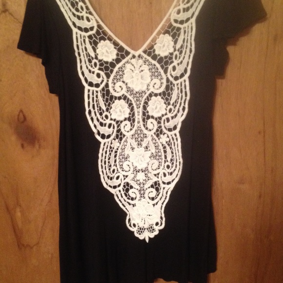 Black top with white lace back.