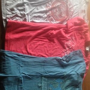 Various colored printed round neck t-shirts.