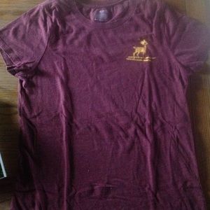 Maroon round neck t-shirt with gold deer.