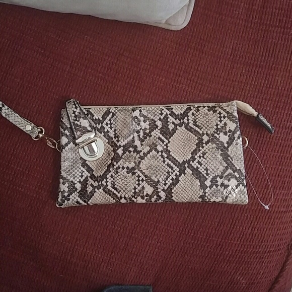 Faux snakeskin wristlet by Olivia Miller