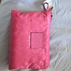 Coach pink and grey foldable tote bag.