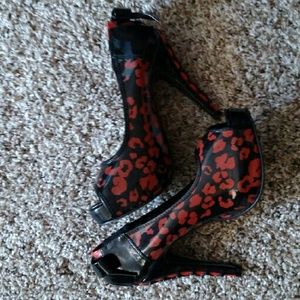 Iron Fist Orange and Black Pumps