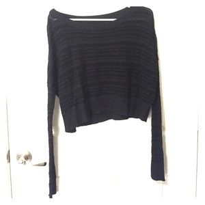 Wide necked, long sleeved crop top.