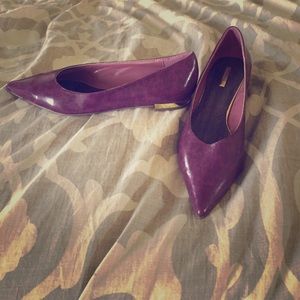 One pair of purple flats