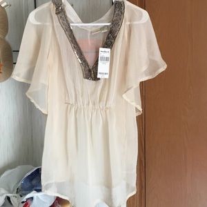 See through cream blouses and gold camisole