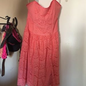 Coral lace strapless summer dress .